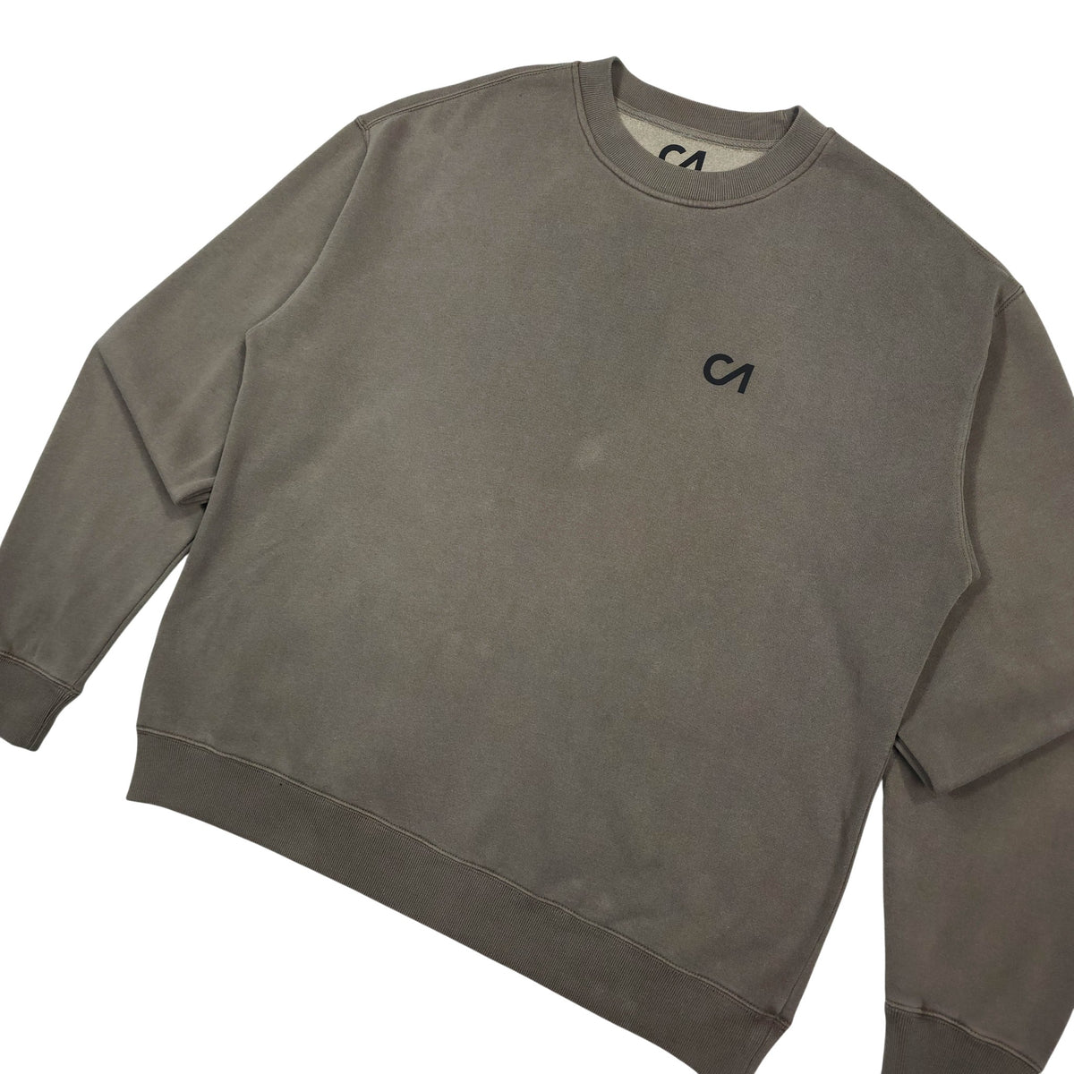Charcoal crewneck pullover sweatshirt, side view with CA logo and ribbed cuffs