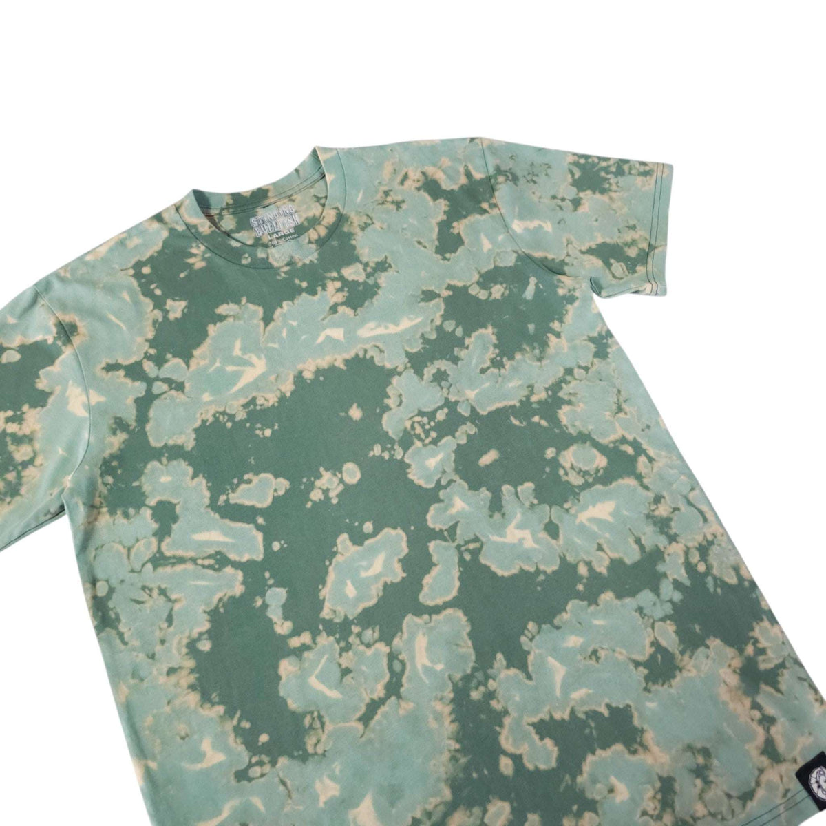 Green bleach-dye camo T-shirt close-up showing crew neck and pattern
