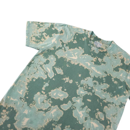 Green bleach-dye camo T-shirt angled view with crew neck and sleeves