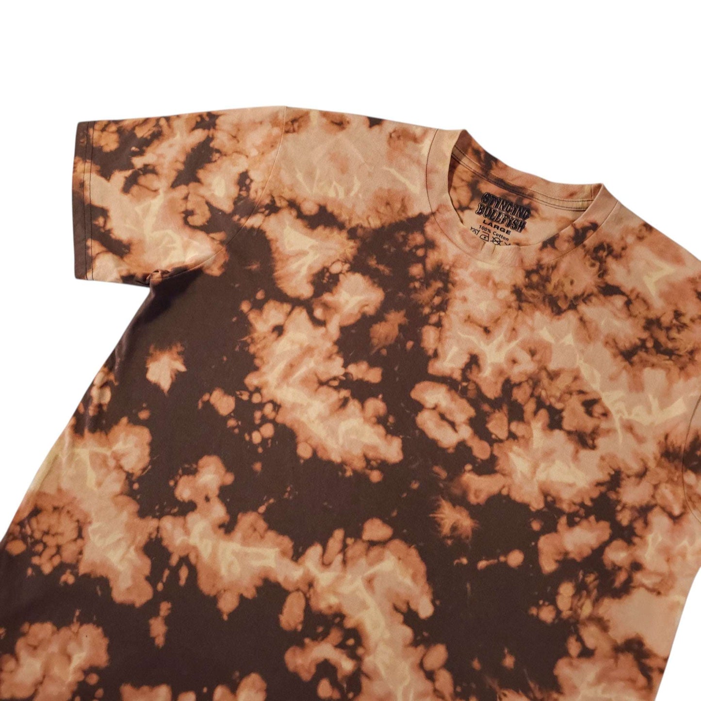 Tie-dye T-shirt with orange and dark brown splatter pattern, crew neck detail.
