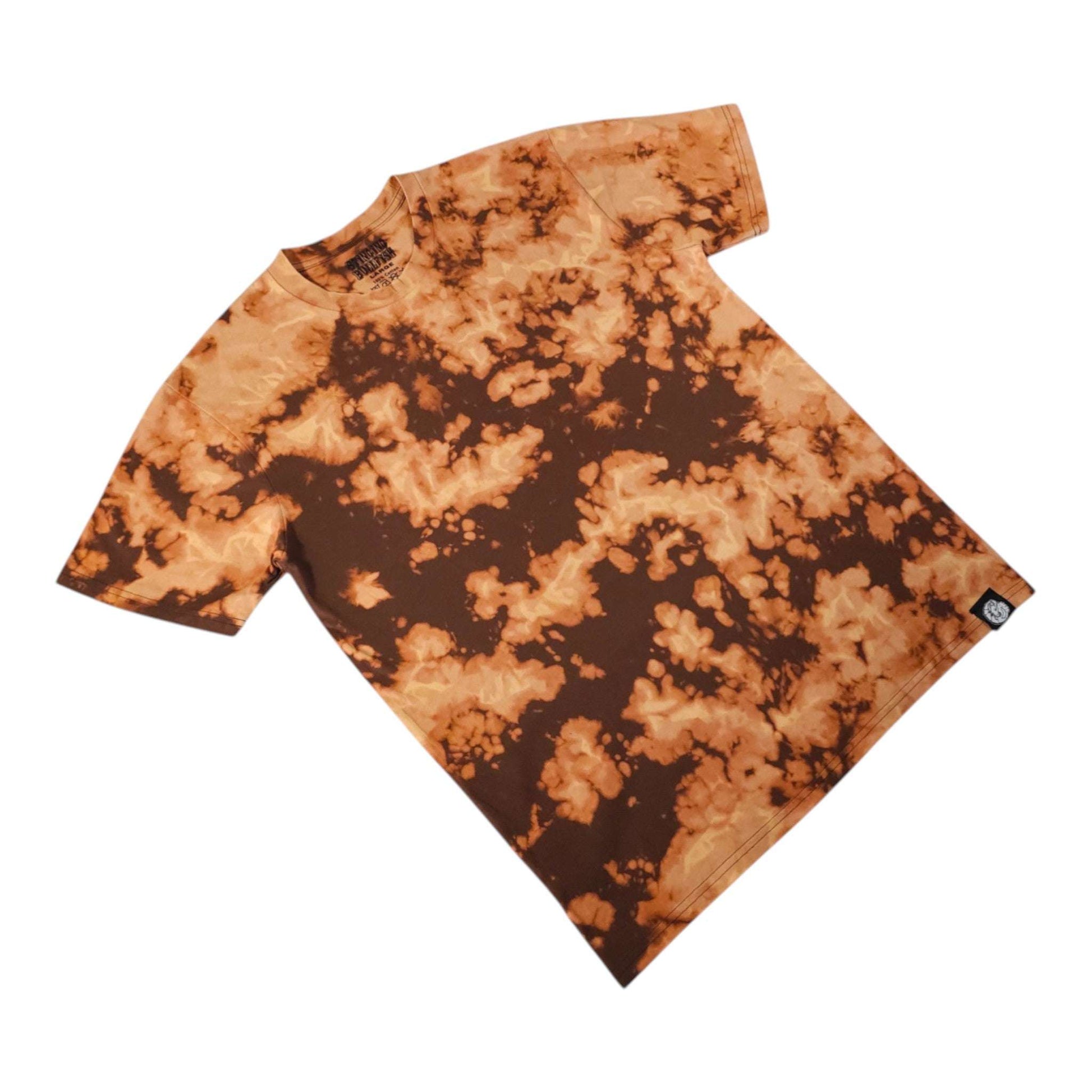 Angled folded tie-dye T-shirt in orange and dark brown, short sleeves and hem.