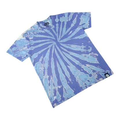 Blue tie-dye T-shirt laid diagonally, spiral burst design, crew neck, short sleeves