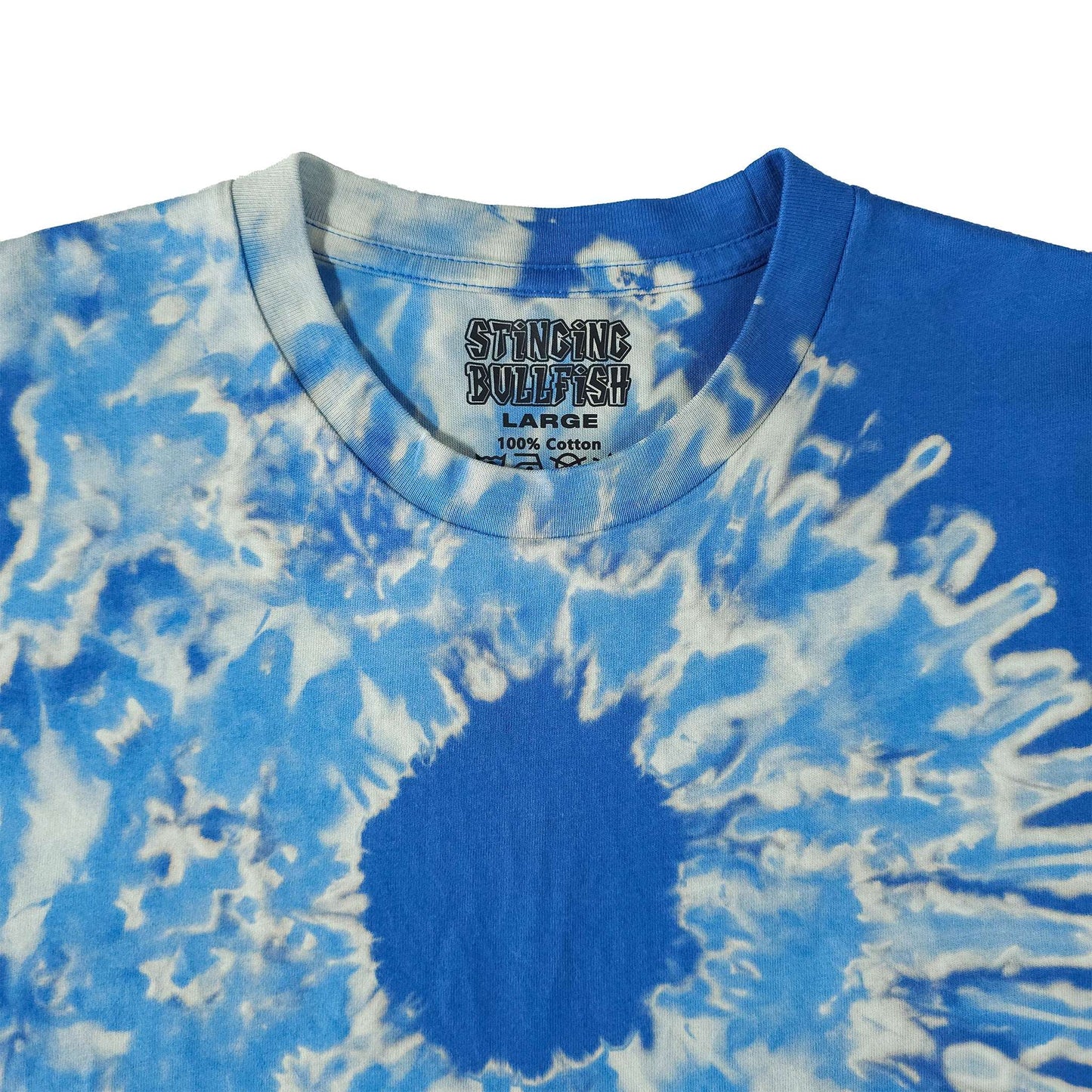Blue bleach-dye T-shirt close-up with white sunburst circle and ragged swirl print