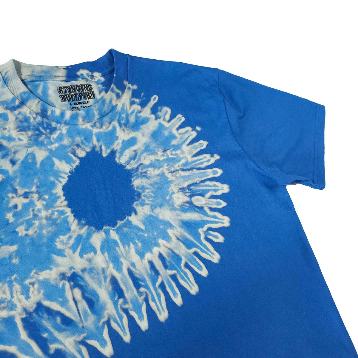 Blue bleach-dye T-shirt with central dark circle and white radial streak detail