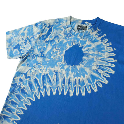 Blue bleach-dye T-shirt with sweeping white radial lines and dark circle chest print