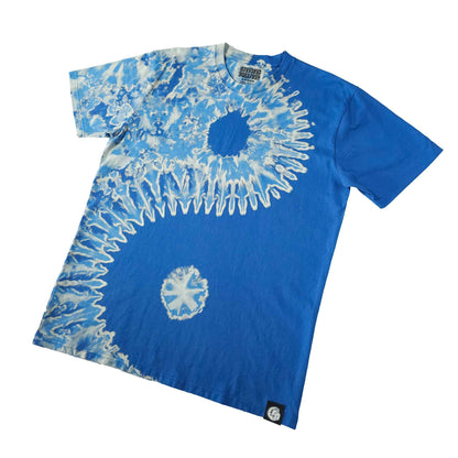 Blue bleach-dye T-shirt with dark center circle and white burst medallion at hem