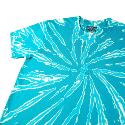 Teal tie-dye T-shirt with bright white radial lines, crew neck, short sleeves.