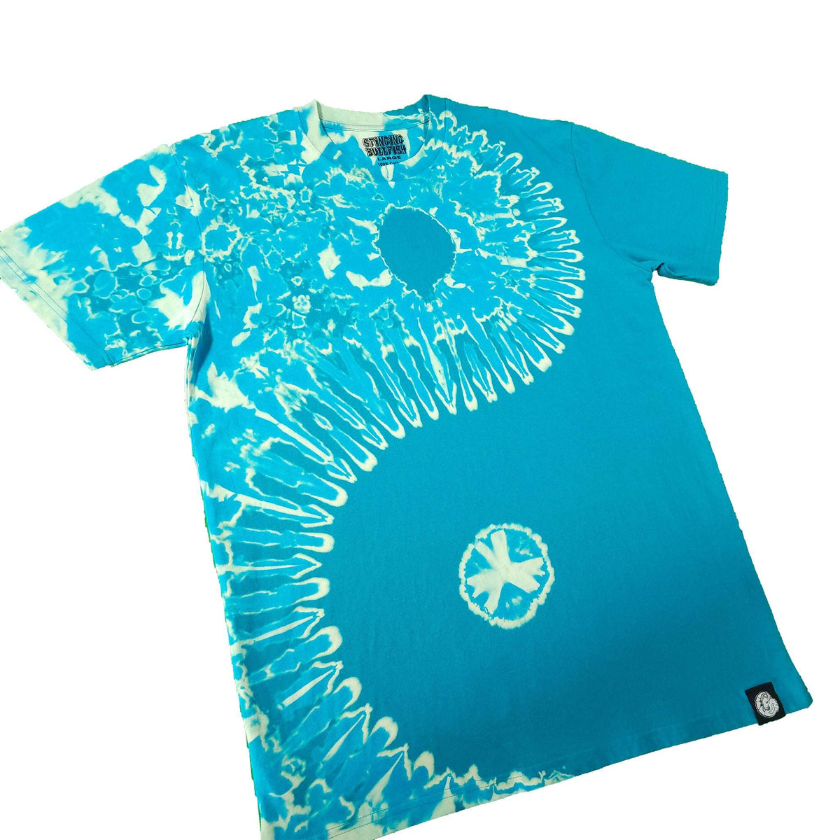 Teal tie-dye T-shirt front view with large white spiral and small peace-style emblem