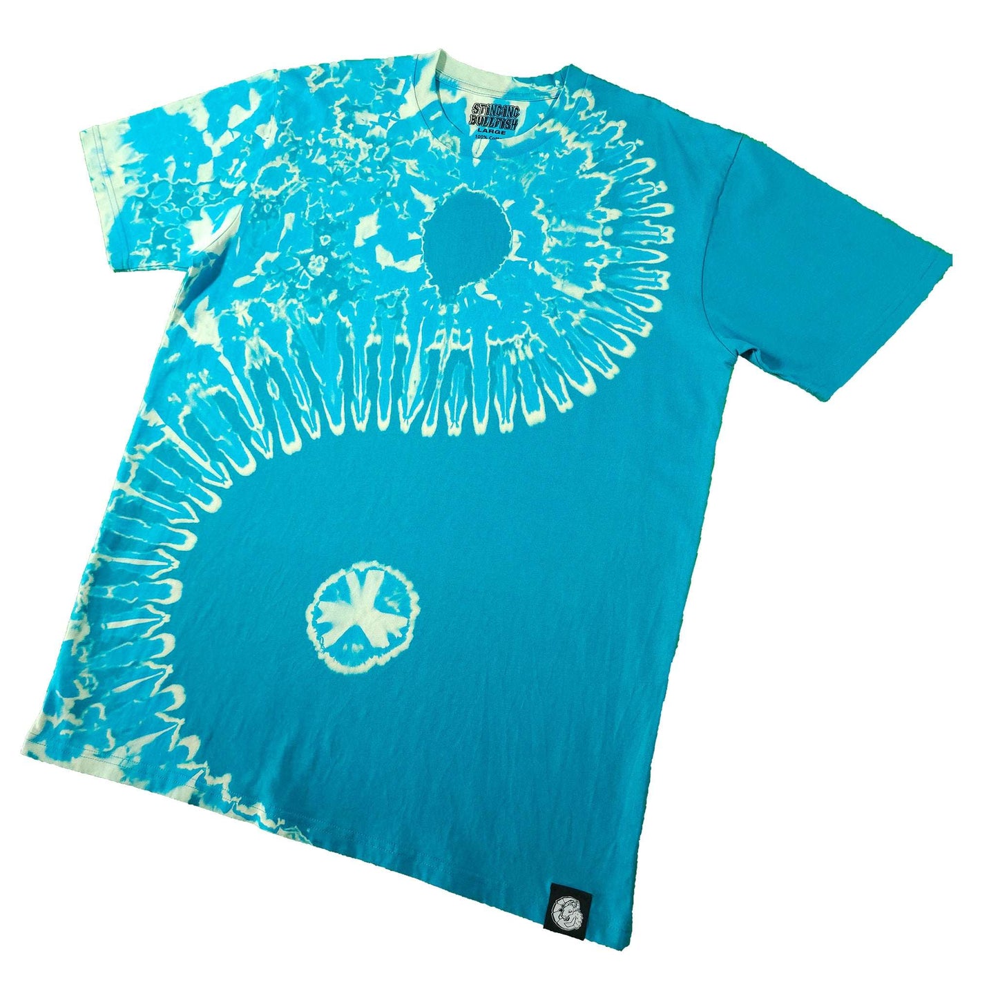 Teal tie-dye T-shirt angled view with white spiral burst and small circular graphic