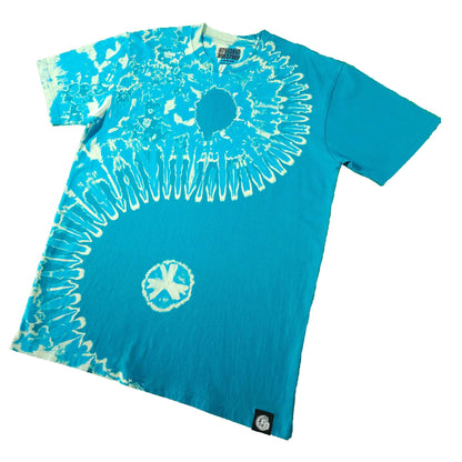 Teal tie-dye T-shirt angled view with white spiral burst and small circular graphic