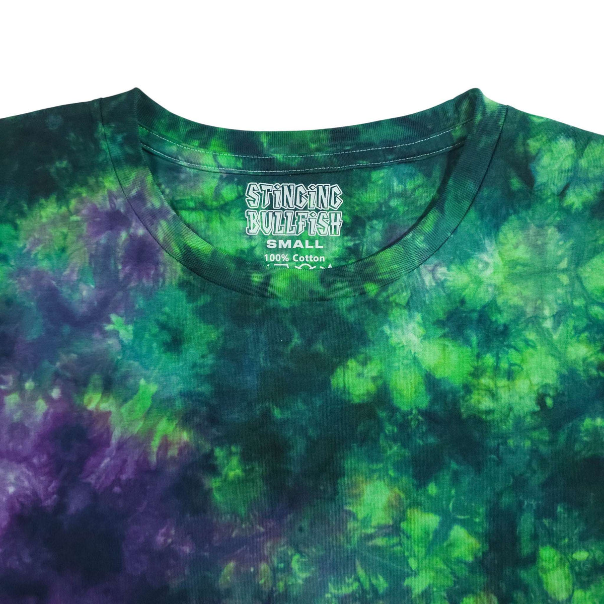 Tie-dye crop top close-up: purple and green crew neck with graphic logo on chest