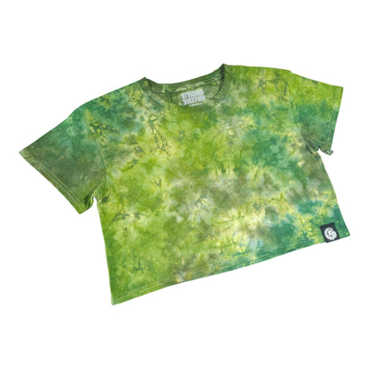 Green tie-dye crop top with short sleeves and crew neckline, small side patch badge.