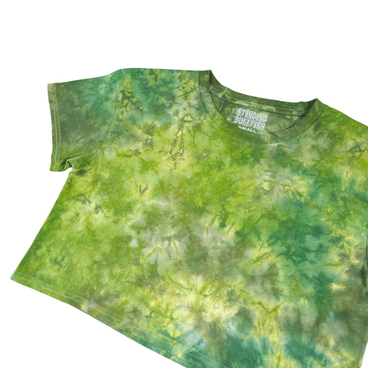 Green tie-dye crop top with short sleeves and crew neckline, fuller pattern on front.