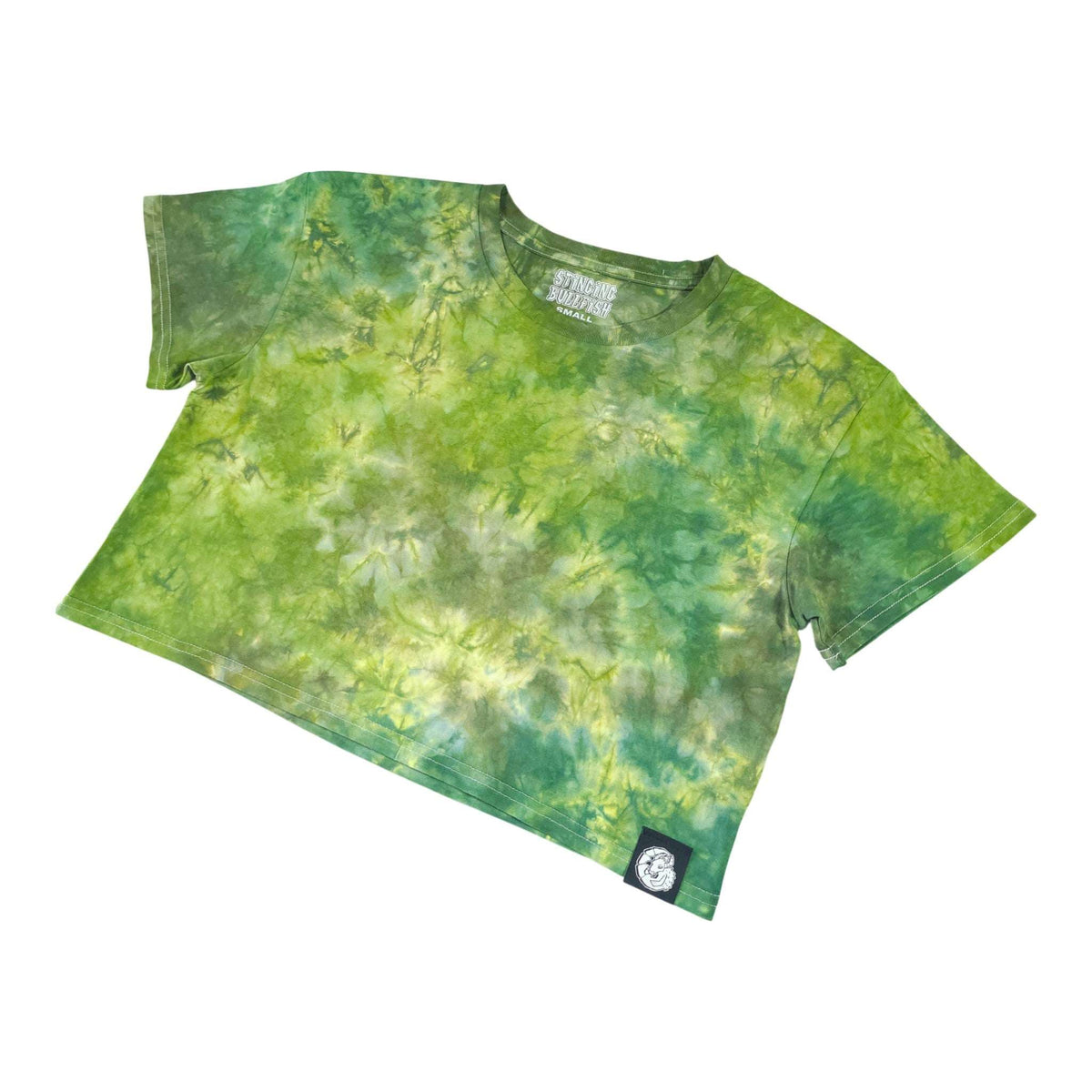 Green tie-dye crop top angled view with short sleeves, crew neck, side patch badge.