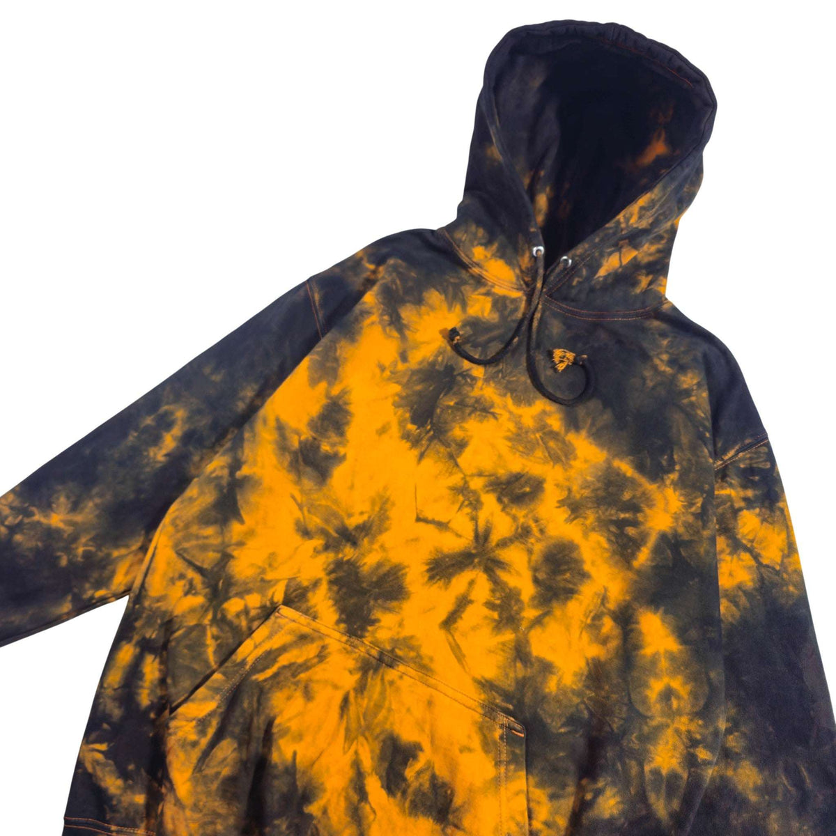 Front view of black and orange tie-dye zip-up hoodie with hood and drawstrings