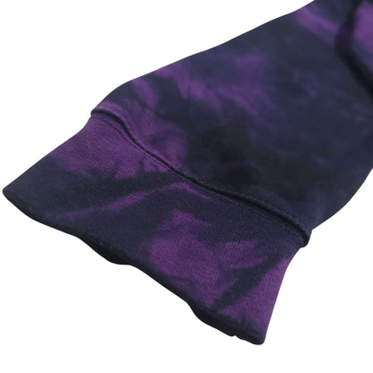 Deep purple-and-black tie-dye hoodie sleeve cuff with ribbed hem detail