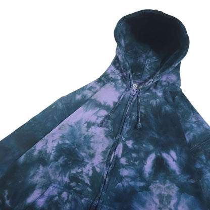 Tie-dye zip-up hoodie, hood up; dark blue outer with purple-lavender and blue tie-dye waves.