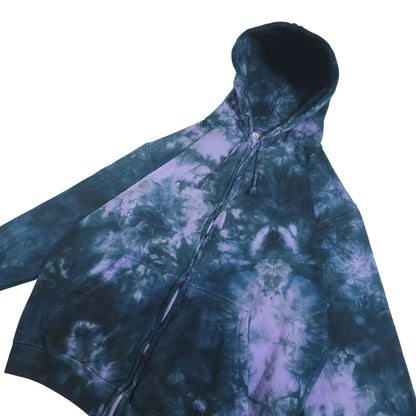 Tie-dye zip hoodie with hood up; long sleeves, dark blue and lavender-purple blended swirls.