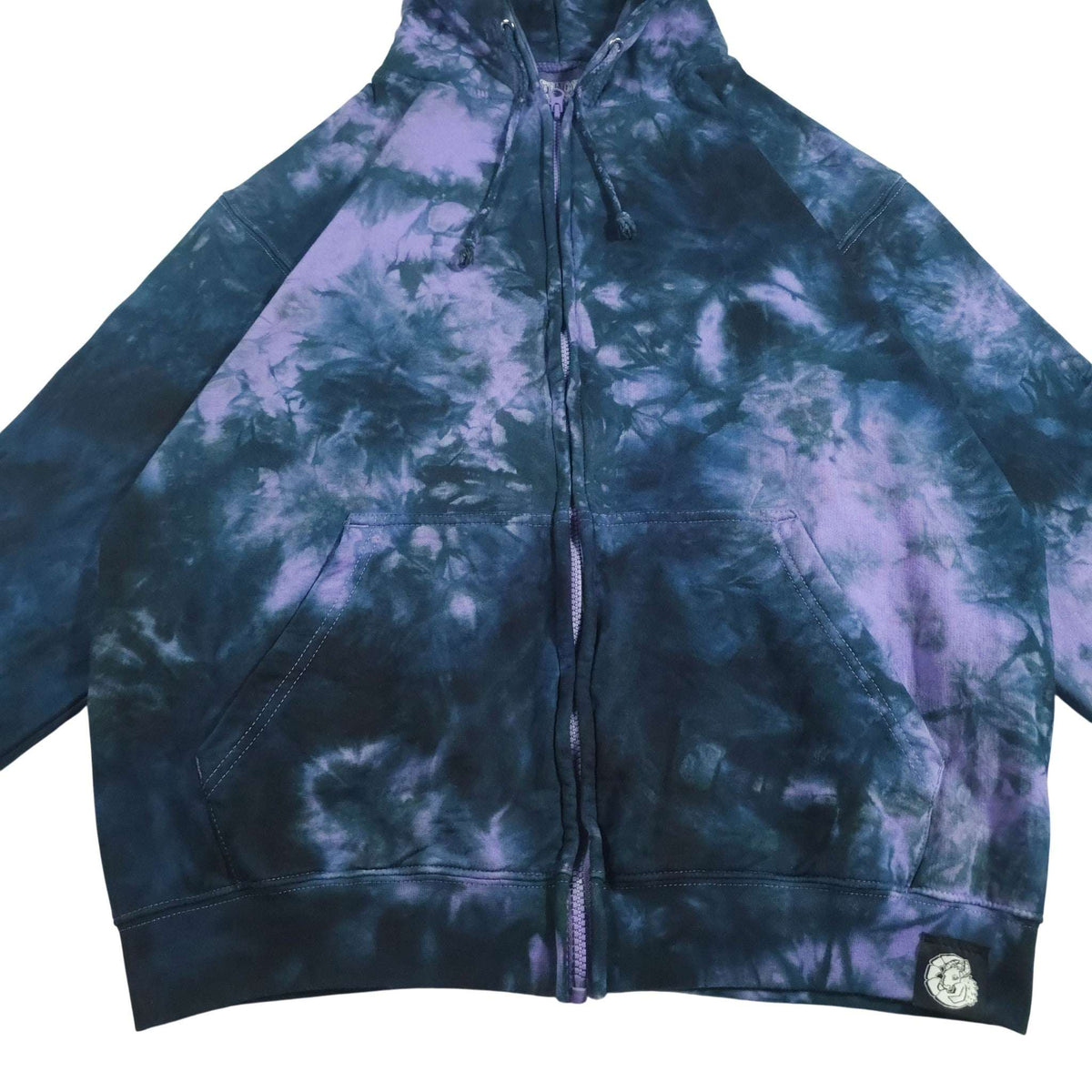 Tie-dye zip-up hoodie front view; dark blue and purple-lavender cloud print with kangaroo pocket.