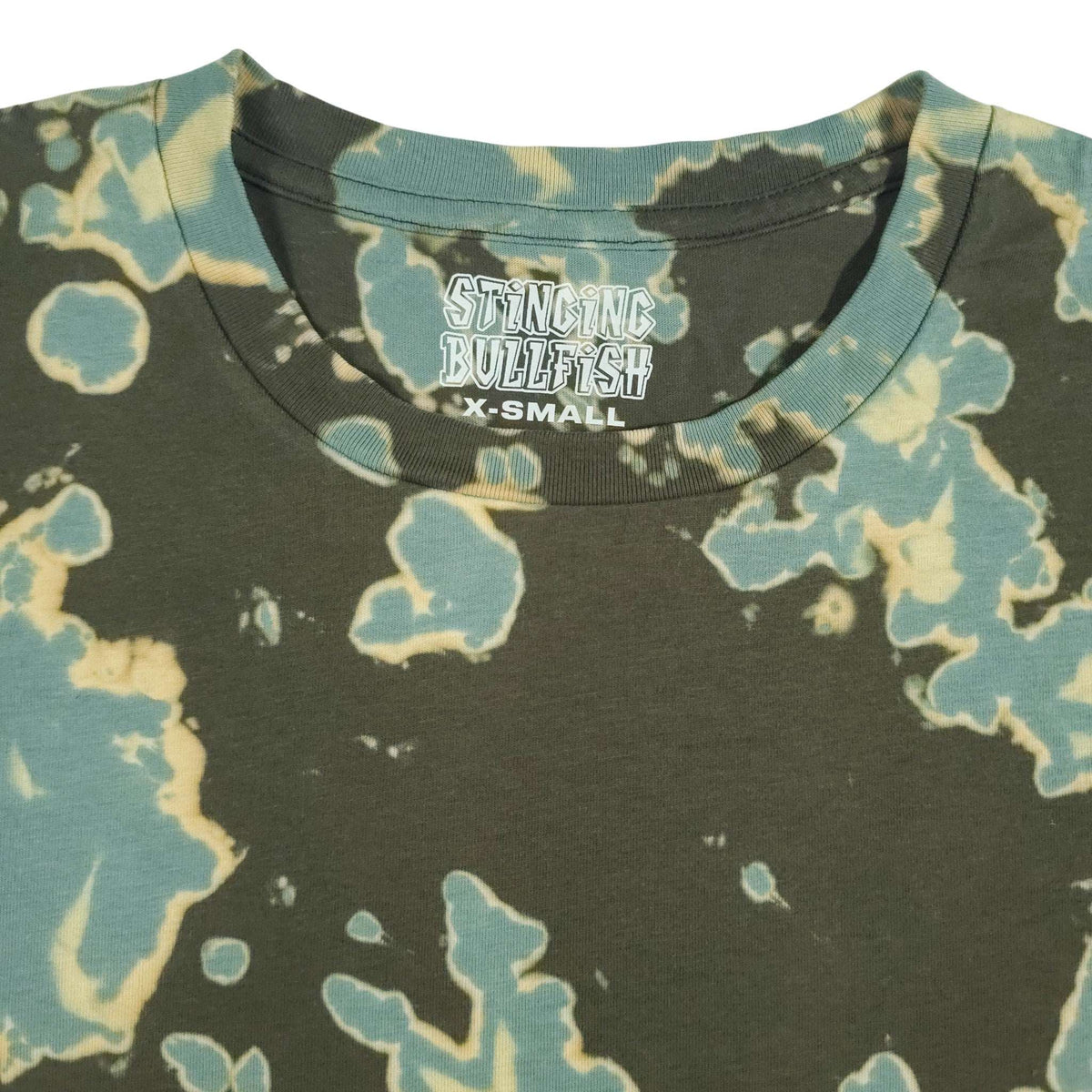 Graphic crewneck crop top with dark green, teal, and pale yellow splash dye print