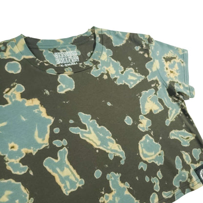 Tie-dye crop top with dark green base and teal and cream irregular paint-like splashes