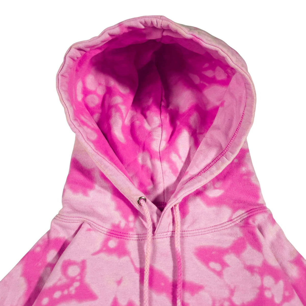 Pink bleach-dyed camo hoodie close-up of hood interior and drawstring with metal tips