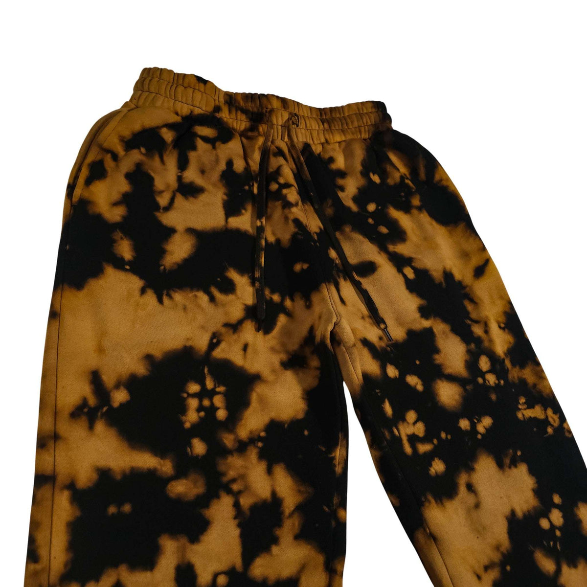 Cuffless tie-dye joggers, elastic waist with drawcord; black-and-tan splatter pattern
