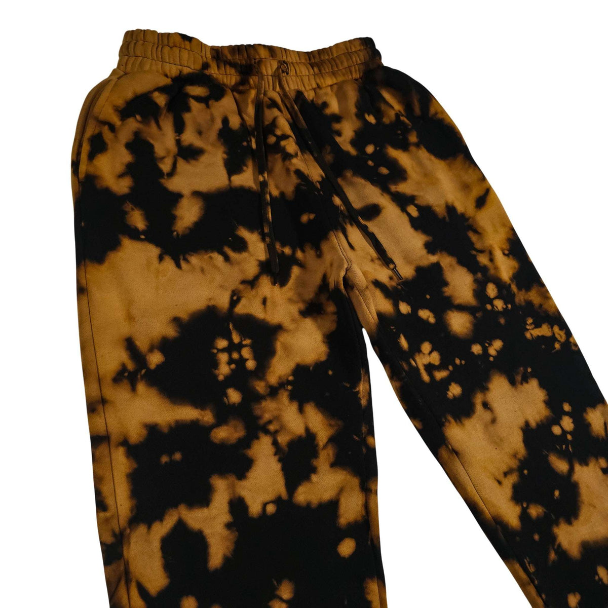 Cuffless tie-dye joggers with elastic waist, drawstring cords, tan-to-black cloud pattern