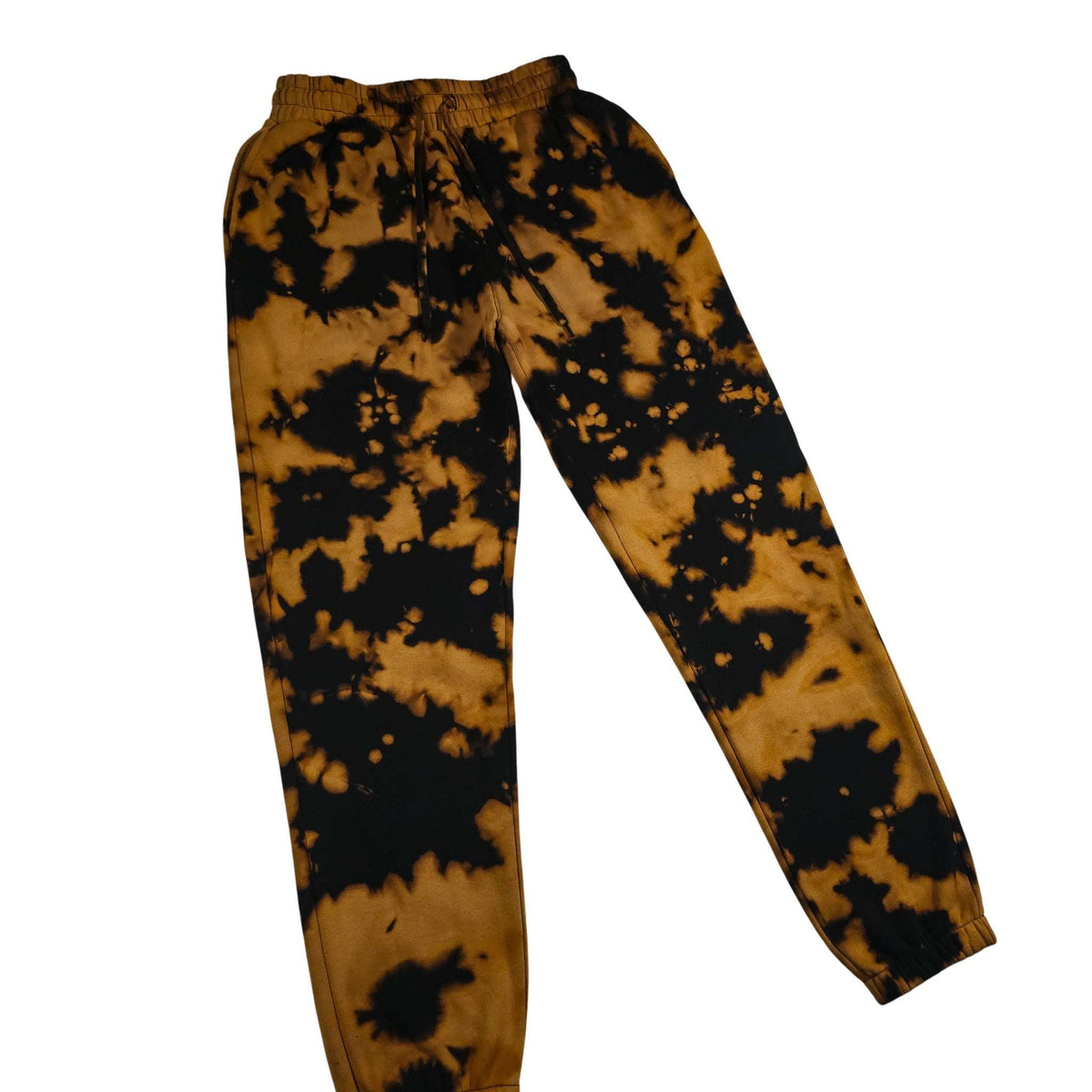 Cuffless tie-dye jogging bottoms with elastic waistband and drawstring; black speckles on tan