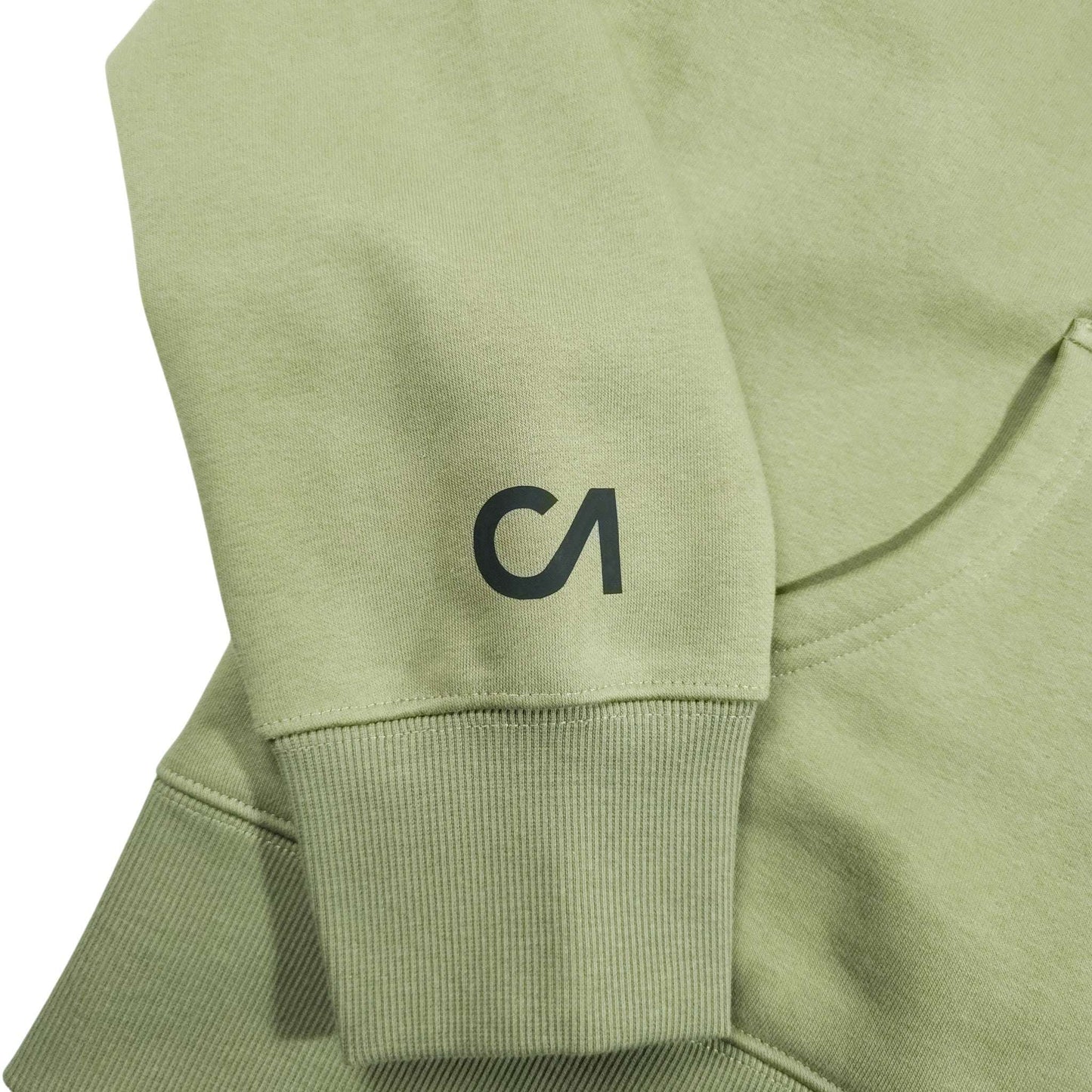 Light green hoodie sleeve detail with ribbed cuff and small CA logo