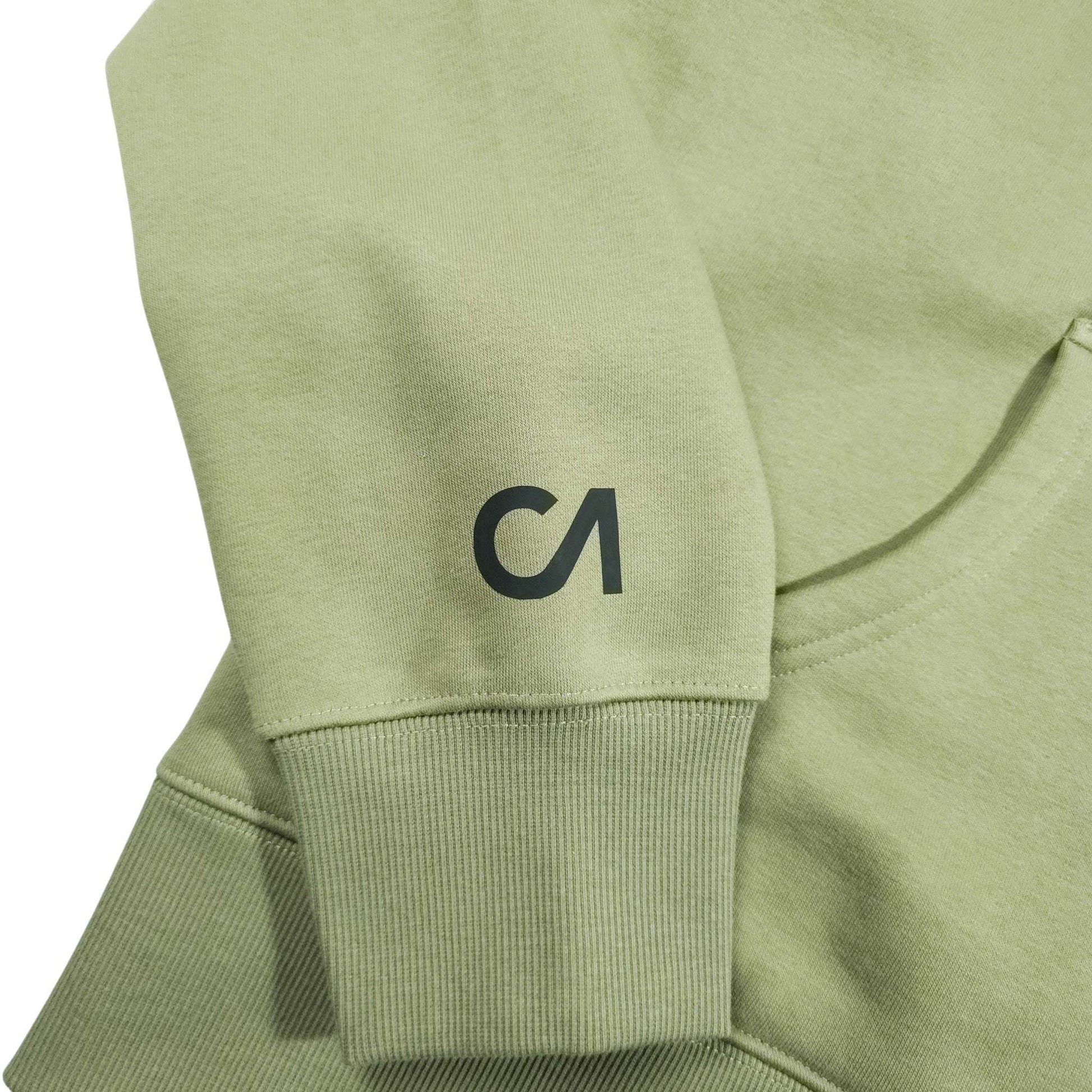 Light green hoodie sleeve detail with ribbed cuff and small CA logo
