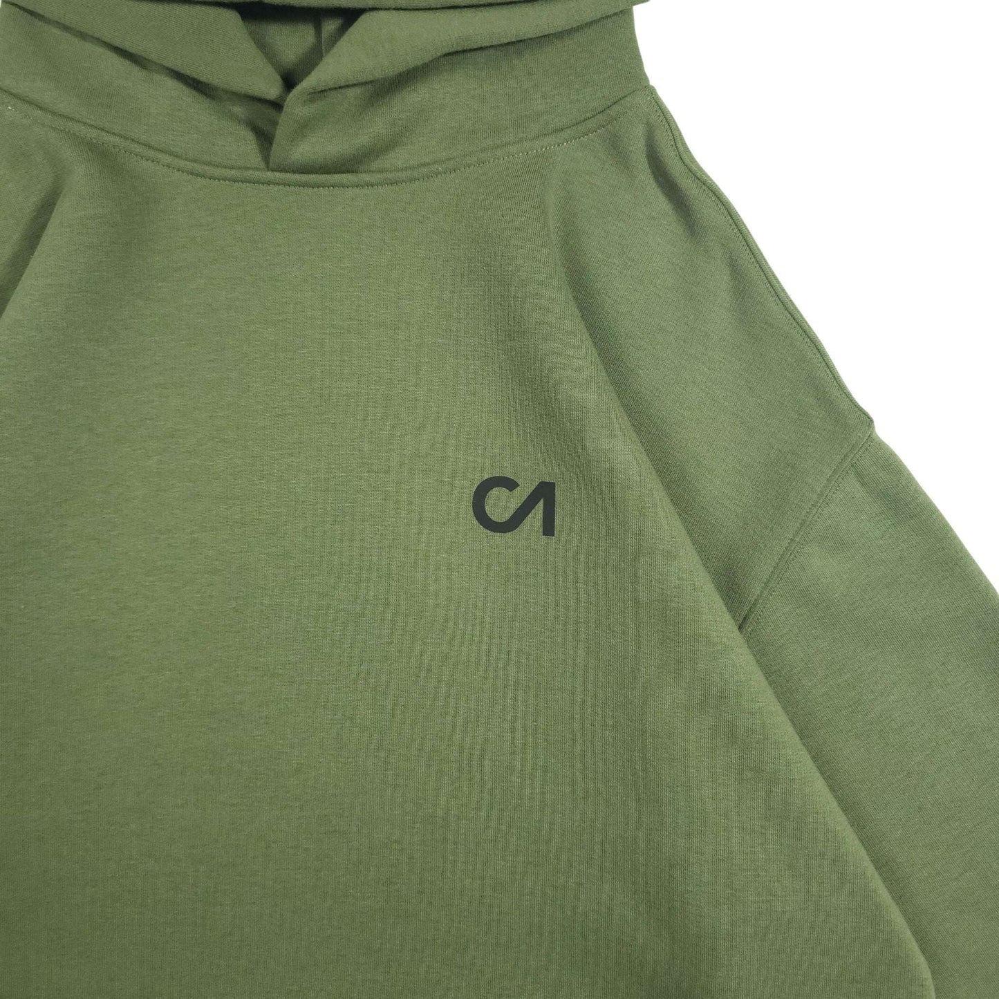Green pullover hoodie chest area with kangaroo pocket and small logo
