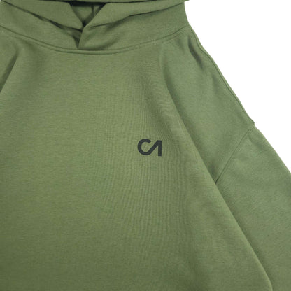 Green pullover hoodie chest area with kangaroo pocket and small logo
