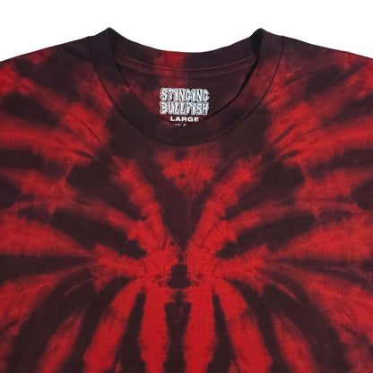 Spider tie-dye T-shirt close-up, red spiral web on dark fabric, crew neck with logo