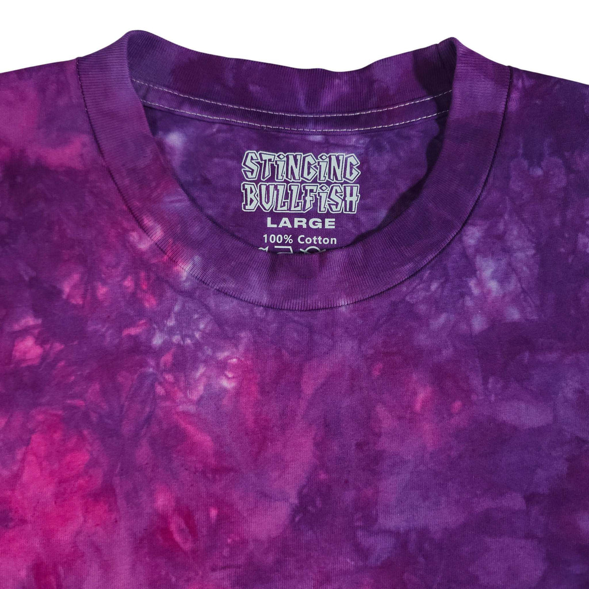 Purple tie-dye T-shirt neckline with 'STINCING BULLFISH' print.