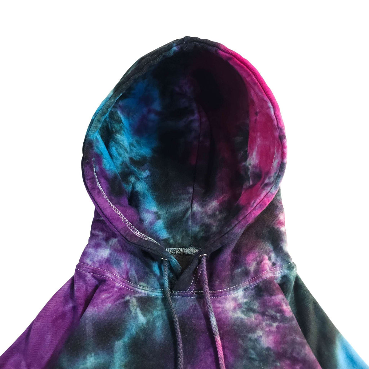 Hooded pullover hoodie close-up, dark tie-dye purple, blue, and pink with drawstrings