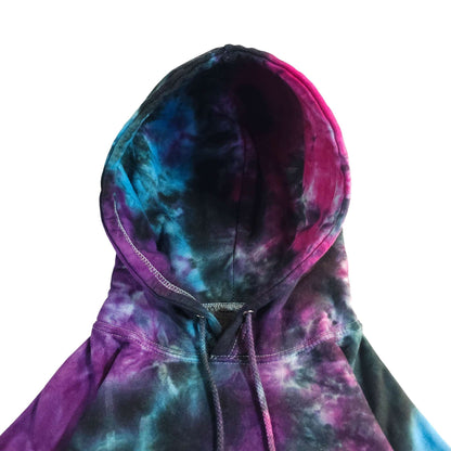 Hooded pullover hoodie close-up, dark tie-dye purple, blue, and pink with drawstrings