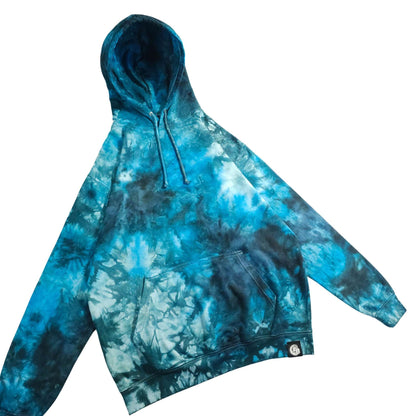 Tie-dye hoodie with kangaroo pocket, hood drawstrings, and relaxed pullover cut