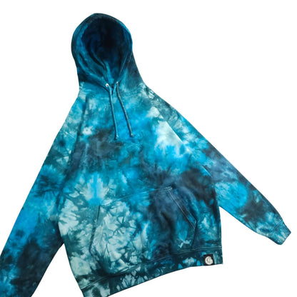 Blue tie-dye pullover hoodie with kangaroo pocket and stitched side detailing