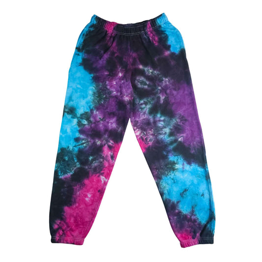 Tie-dye jogging bottoms with elastic waistband, tapered legs in blue/purple/pink swirl