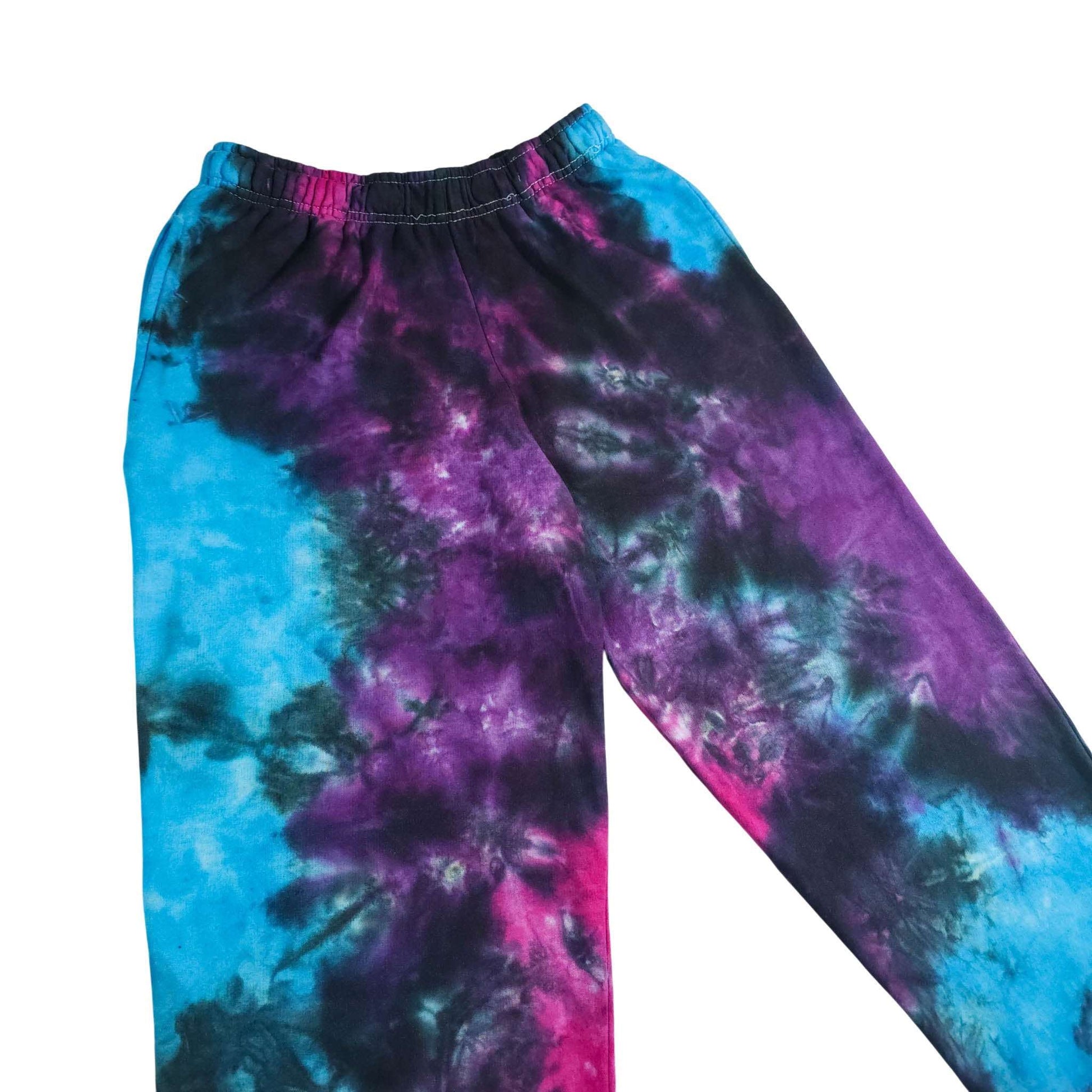 Tie-dye joggers, elastic waistband and tapered legs; blue left, purple right with pink accents