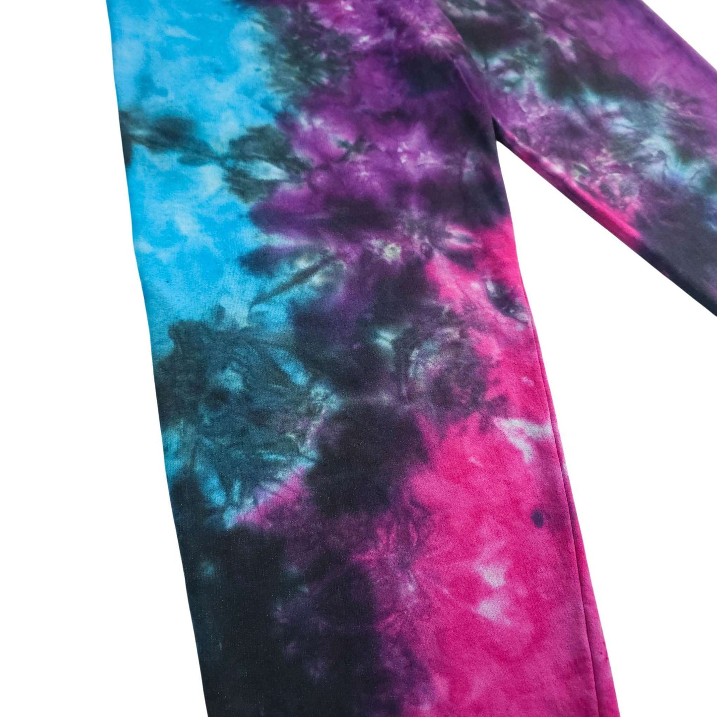 Tie-dye jogging pants detail view of leg, blue and purple swirls with pink highlights