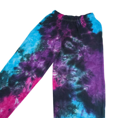 Tie-dye jogging bottoms with elastic waistband; blue, purple and pink nebula pattern