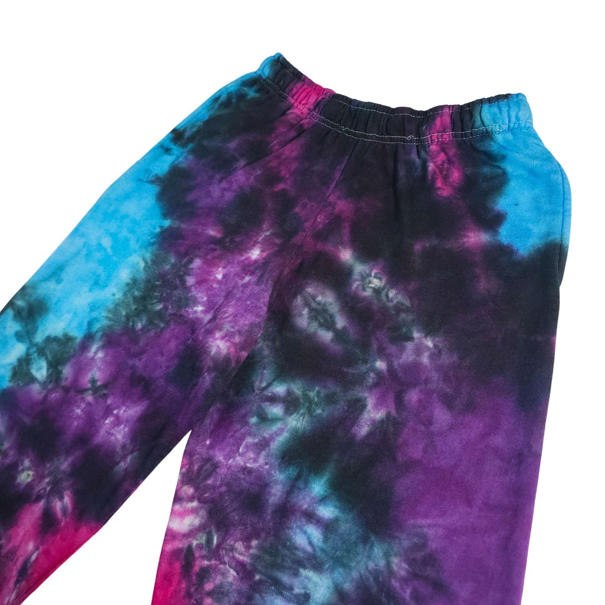 Tie-dye joggers close-up of waistband and upper legs; blue, purple and magenta swirls