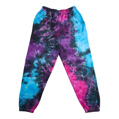 Tie-dye jogging bottoms with elastic waistband and tapered legs; blue, purple and pink pattern