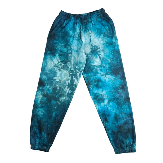 Blue tie-dye jogging bottoms with elastic waistband and ribbed ankle cuffs
