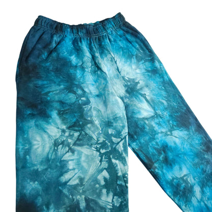 Blue tie-dye jogger pants with elastic waistband and relaxed tapered leg