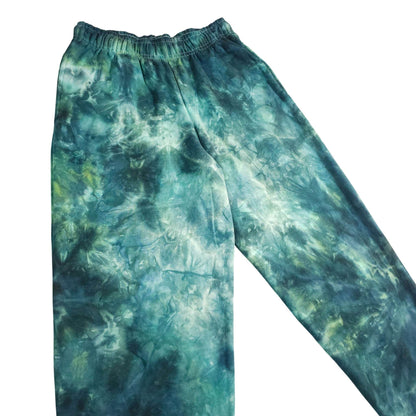 Teal/green tie-dye jogger pants with elastic waist and relaxed tapered fit.