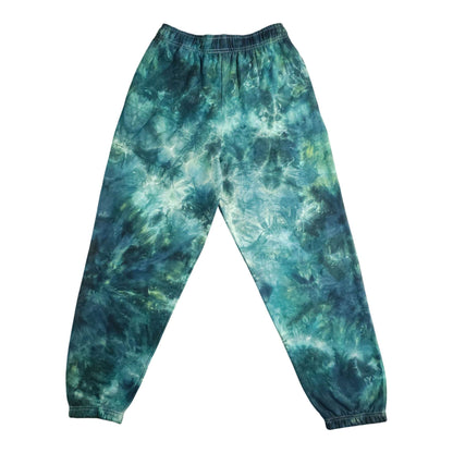 Teal and dark-green tie-dye joggers with elastic waistband and ribbed ankle cuffs