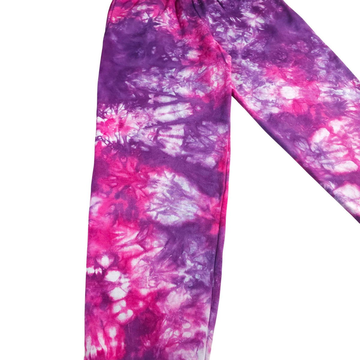 Purple and pink tie-dye jogger pants close-up showing tapered leg and cuffs